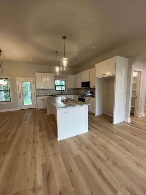 Open-plan kitchen and living area after a post-construction clean